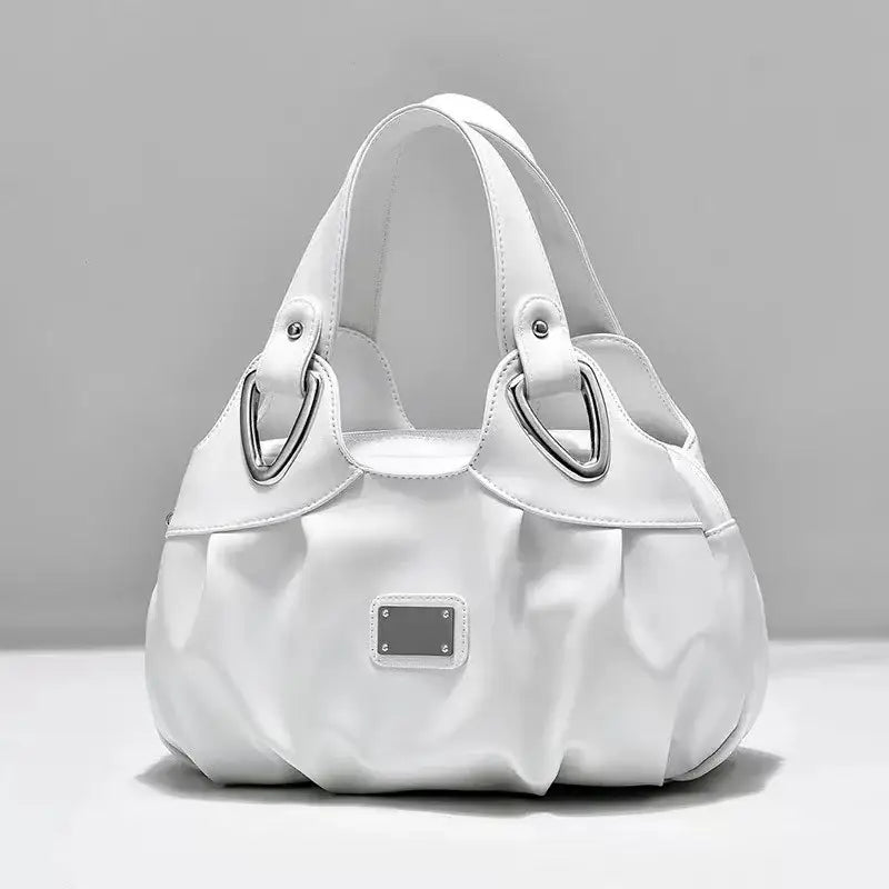 a white purse bag on a white surface