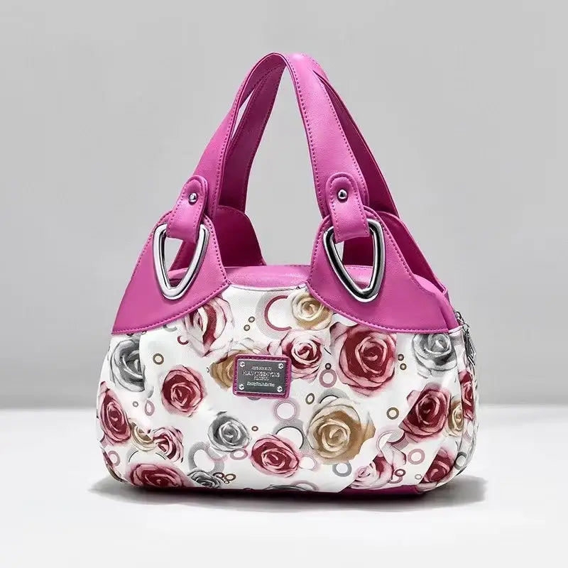 a white purse with pink roses on it