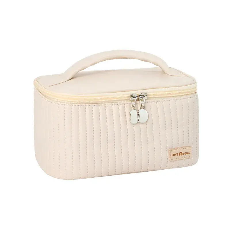 the white quilted cosmetic bag