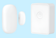 White rectangular smart home sensor or security device with a circular button or indicator.