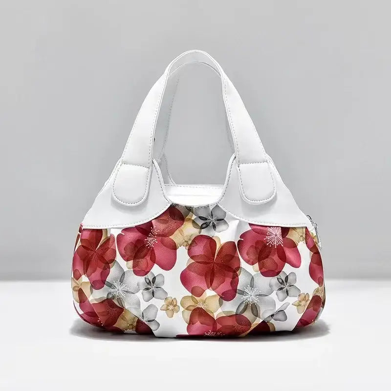 a white and red floral purse bag
