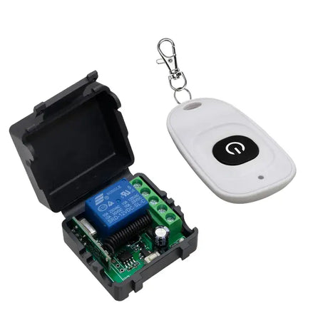 A white remote control device with a key