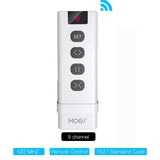 White remote control with multiple buttons.
