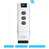 White remote control with three buttons.