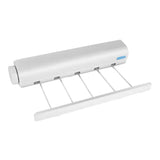 the white plastic roll holder is attached to a white plastic roll holder