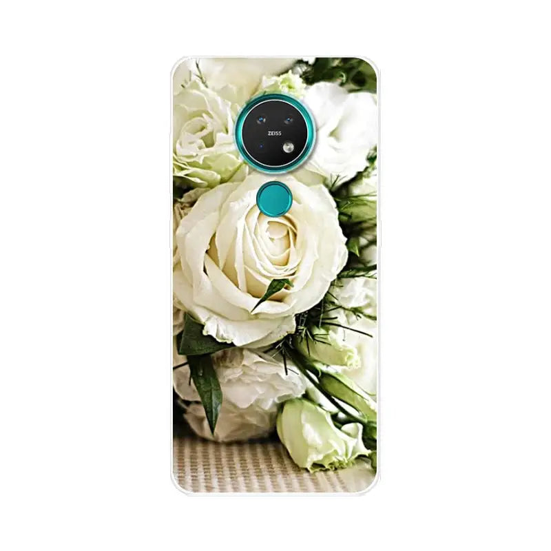 a bouquet of white roses and green leaves on a white background