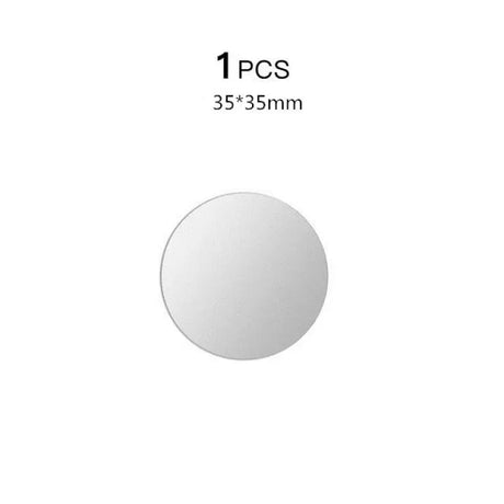 a round mirror with a white background