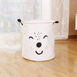 a white dog shaped laundry basket on the floor