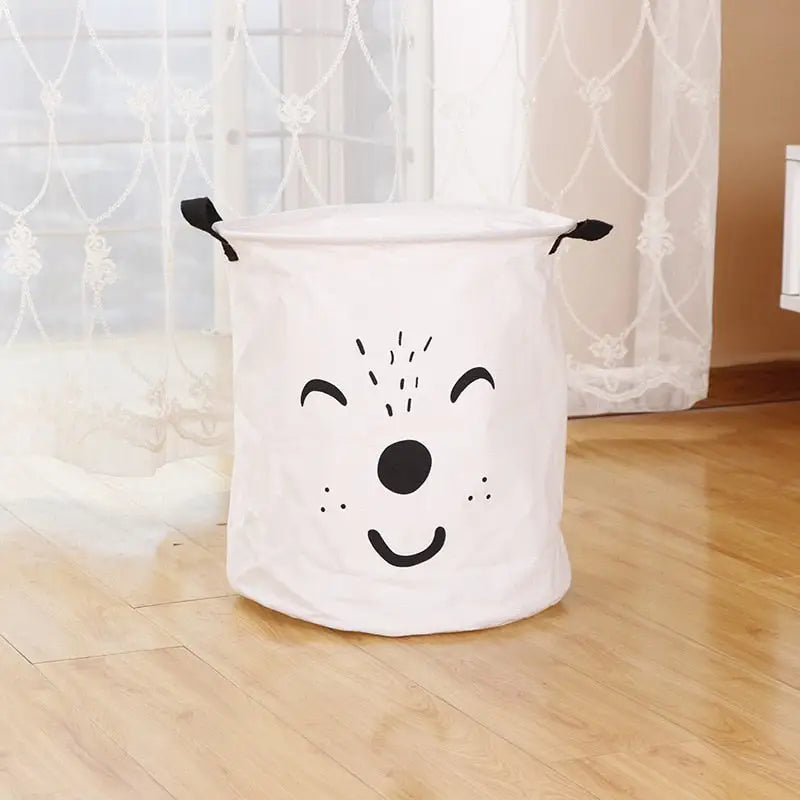 a white dog shaped laundry basket on the floor