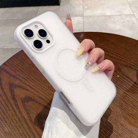 White silicone iPhone case with a built-in MagSafe ring and camera protection.