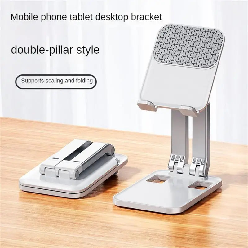 a white and silver phone stand on a wooden table