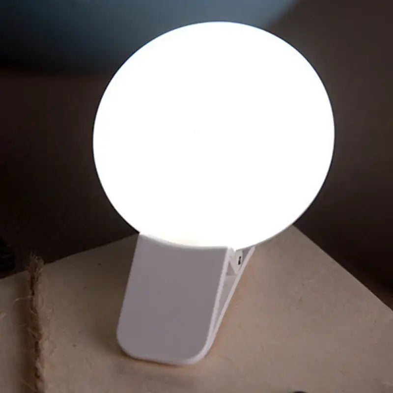 a white light sitting on top of a cardboard box