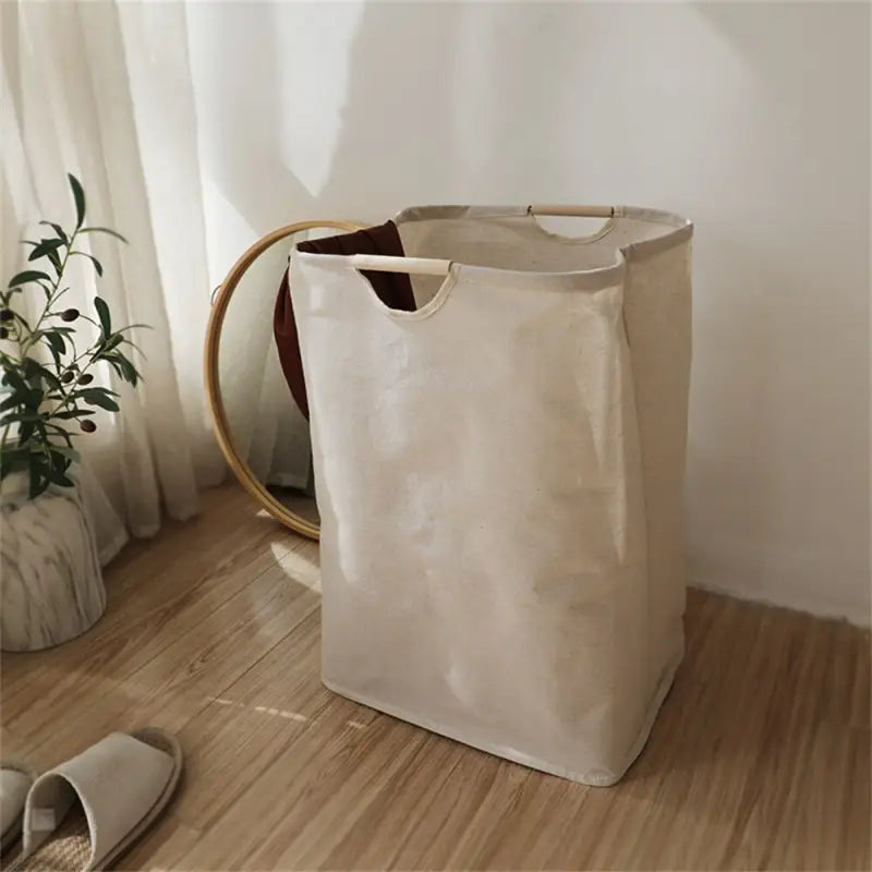 a white bag sitting on a wooden floor