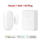 a white smart home security system with a button and a remote control