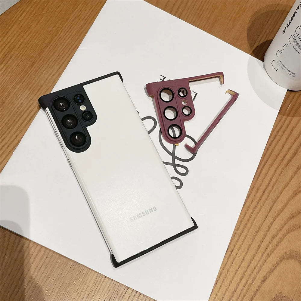 White smartphone with a black camera module and a detached maroon camera lens protector.