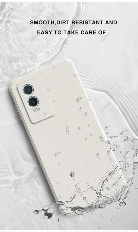 White smartphone with dual cameras being splashed with water.