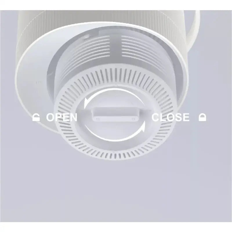 a white smoke detector with the words open close