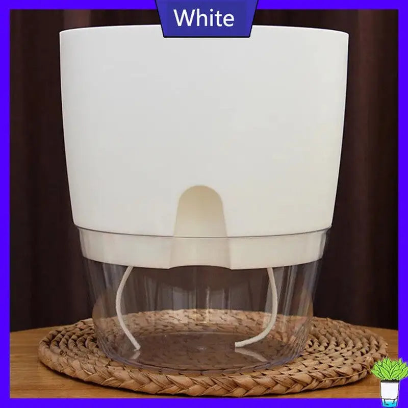 a white cup with a handle on top