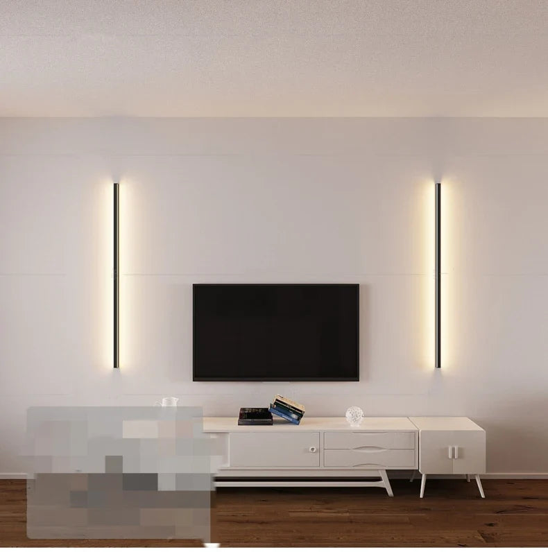 a white tv stand with two lights on it