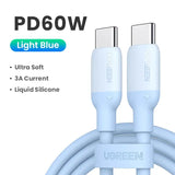 a white usb cable with a blue light blue cable
