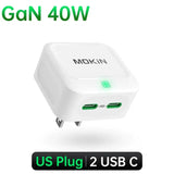 a white usb charger with a green light on top of it