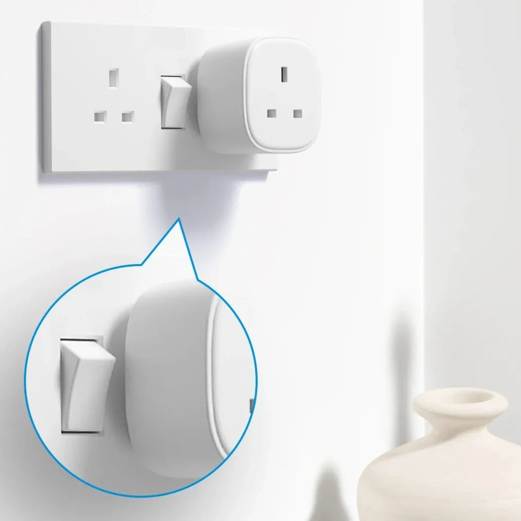 a white wall mounted switch with a blue circle