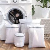 a washing machine with three bags of laundry deter