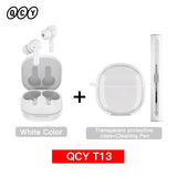 White wireless earbuds with charging case and accessories.