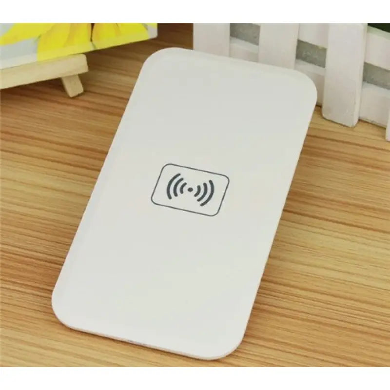 a white wireless device on a wooden floor