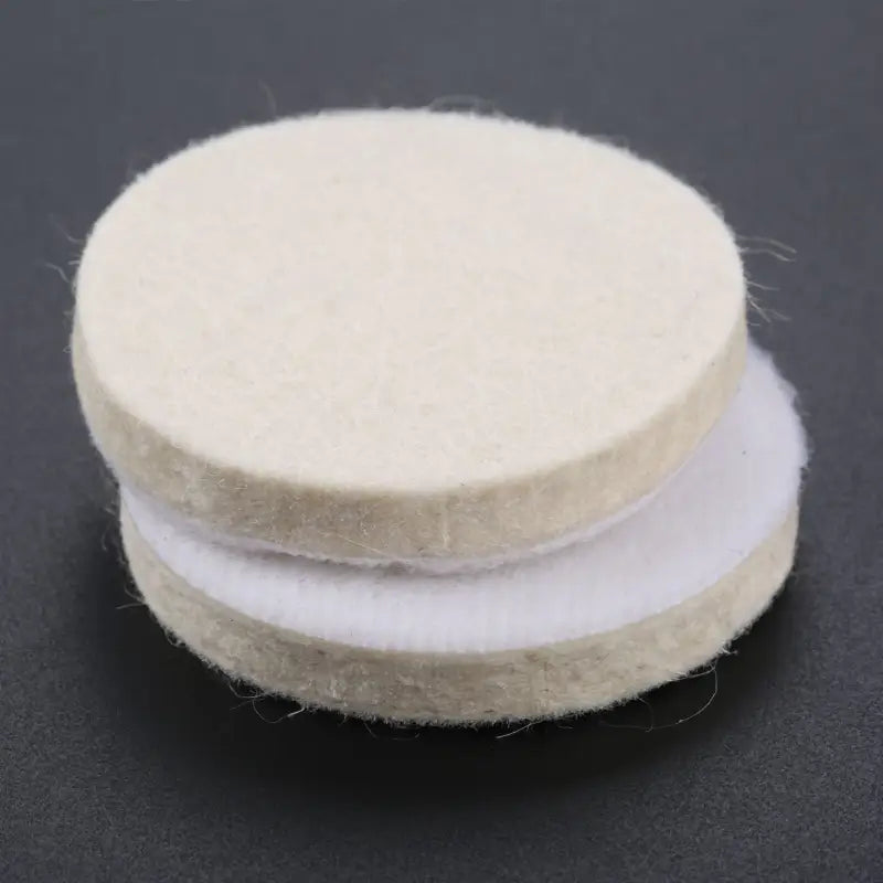 a white round felt with a white circle on top