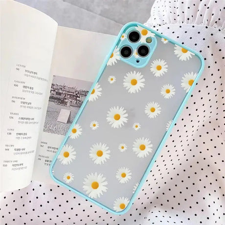 A white and yellow daisy print phone case