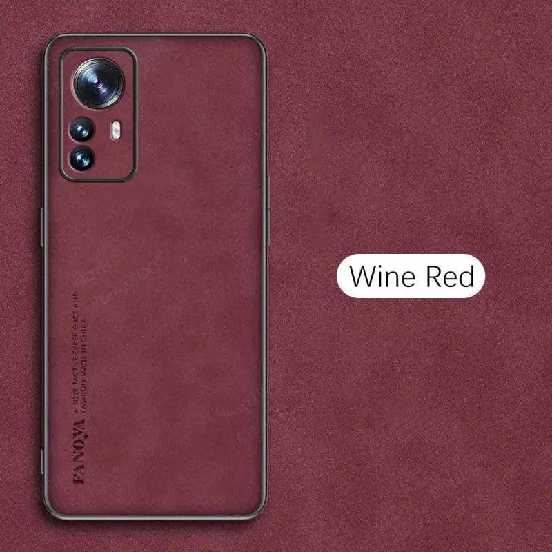 the back of a red samsung s20 with a wine red leather case