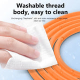 a hand wiping a hose with a cloth