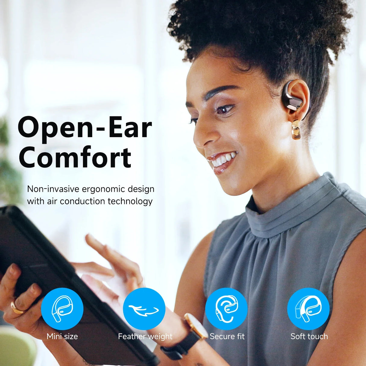 Wireless earbud or headphone with an open-ear design, worn by a smiling person.