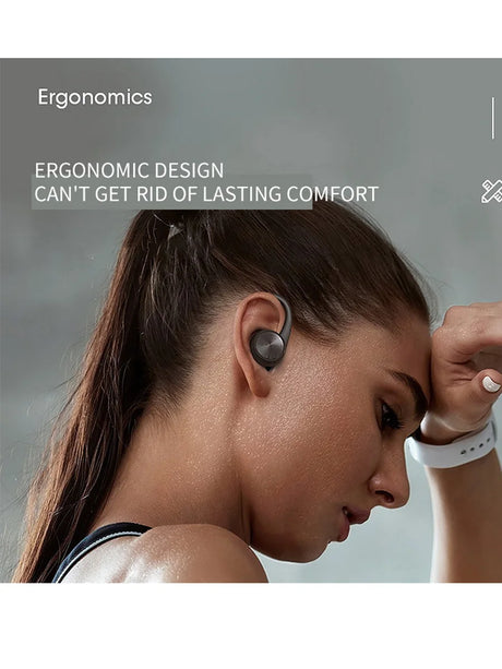 Wireless earbud worn in a person’s ear.