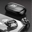 Wireless earbuds with a charging case displaying the Xiaomi (Mi) logo.