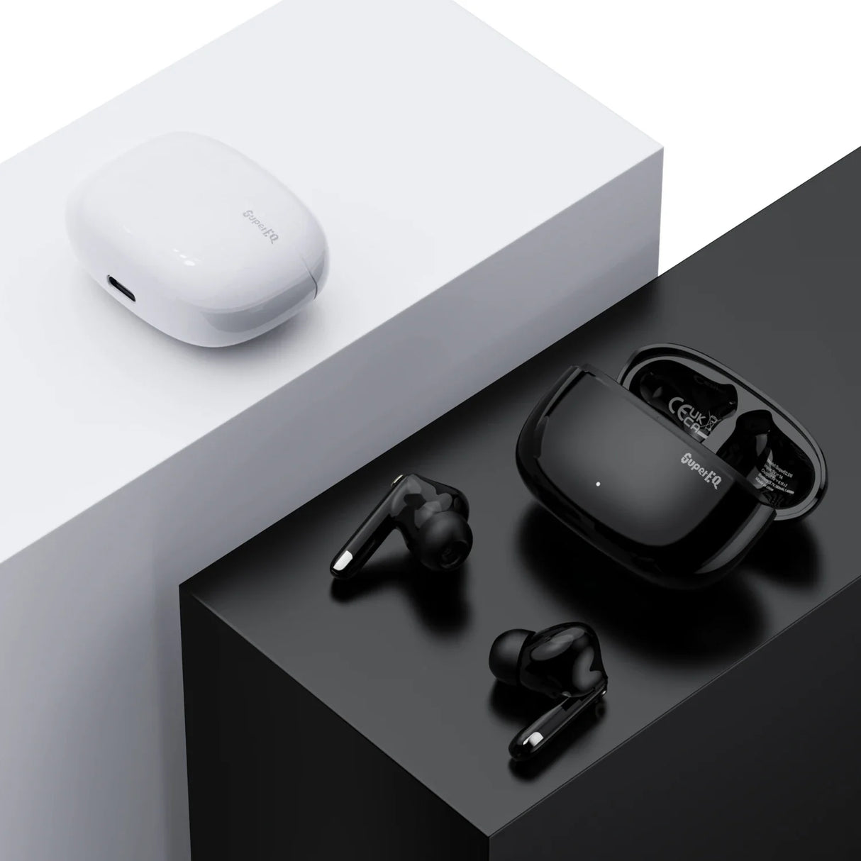 Wireless earbuds with charging cases in contrasting black and white colors.