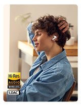 Wireless earbuds in use.
