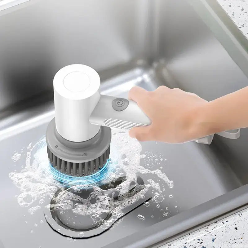 a person washing a sink with a hand held over the sink