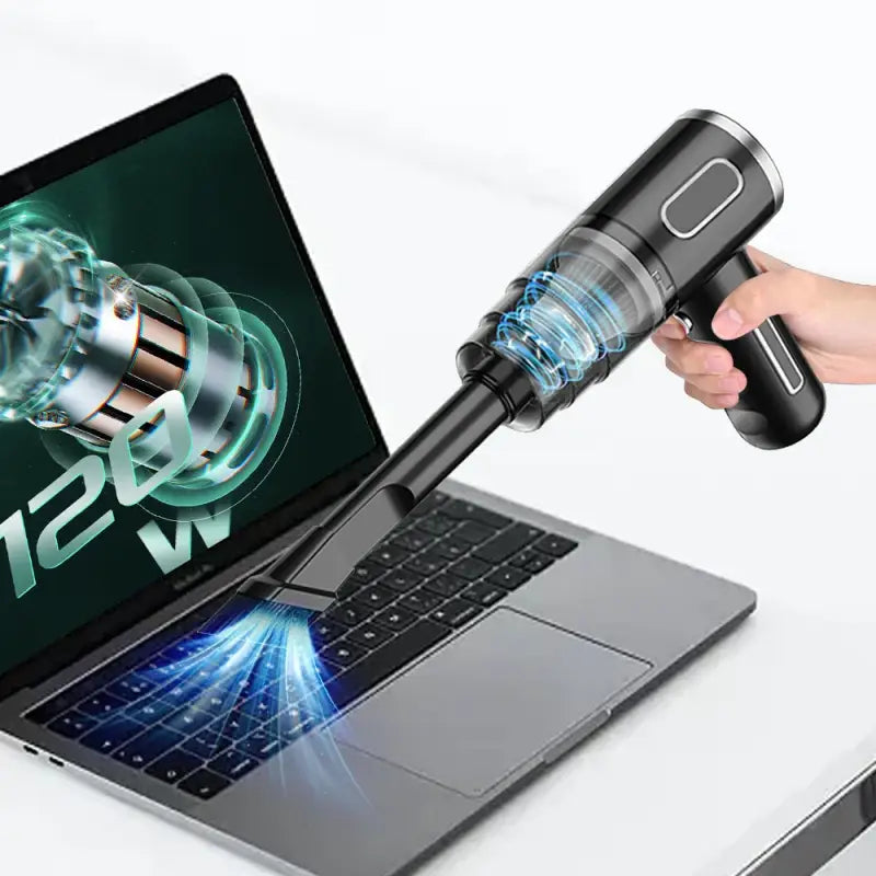 someone is using a laptop computer to use a laser gun