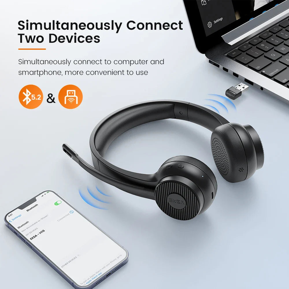 Wireless headset with microphone positioned near a smartphone and laptop.