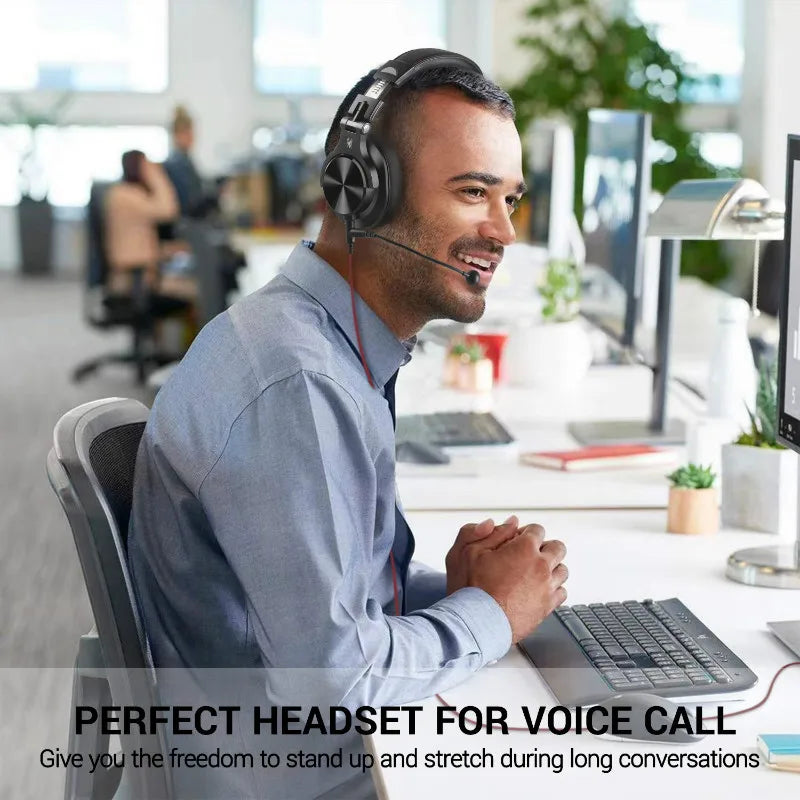 Wireless headset with microphone worn by a smiling office worker.