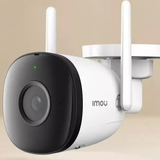 Wireless outdoor security camera with dual antennas and a rounded design.