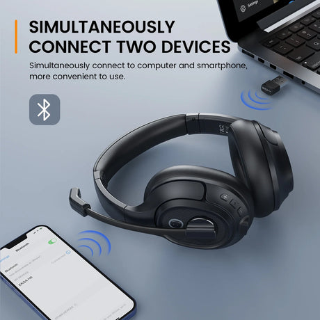 Wireless over-ear headphones with a microphone boom.