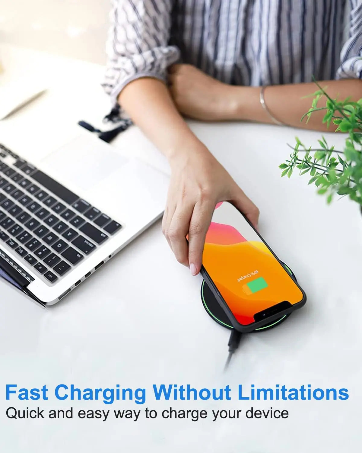 Wireless charging pad with a colorful display showing a battery icon.