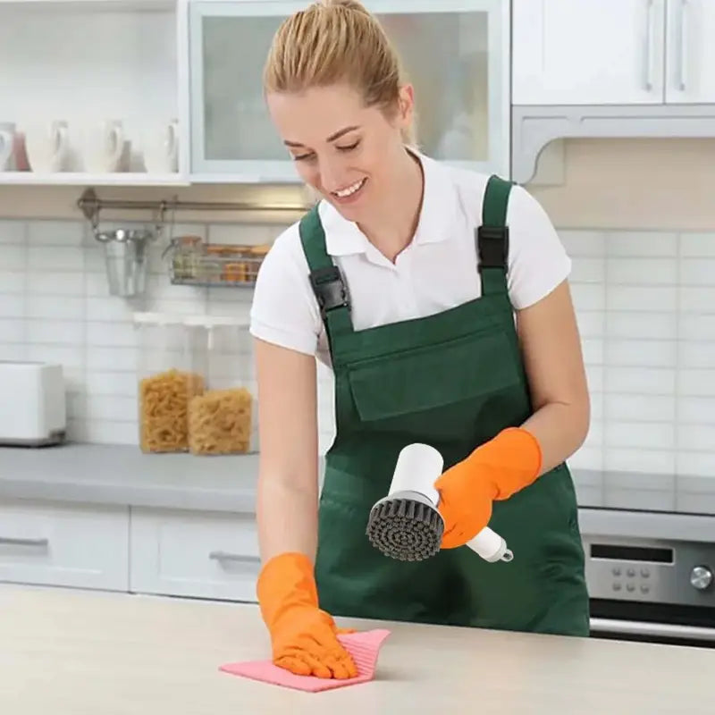 a woman in an apron and apron cleaning a counter