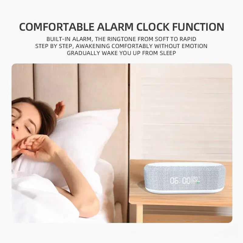 a woman laying in bed with the alarm clock