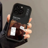 a woman holding a black coffee phone case