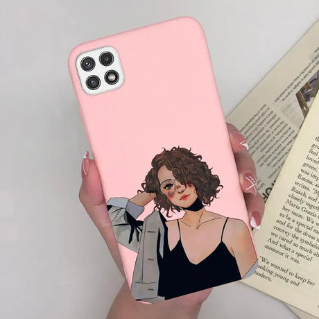 a woman in a black dress holding a pink phone case