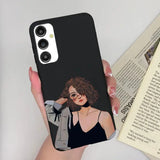 a woman holding a phone case with a picture of herself